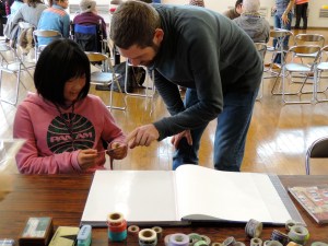 RJ helping design photo albums.